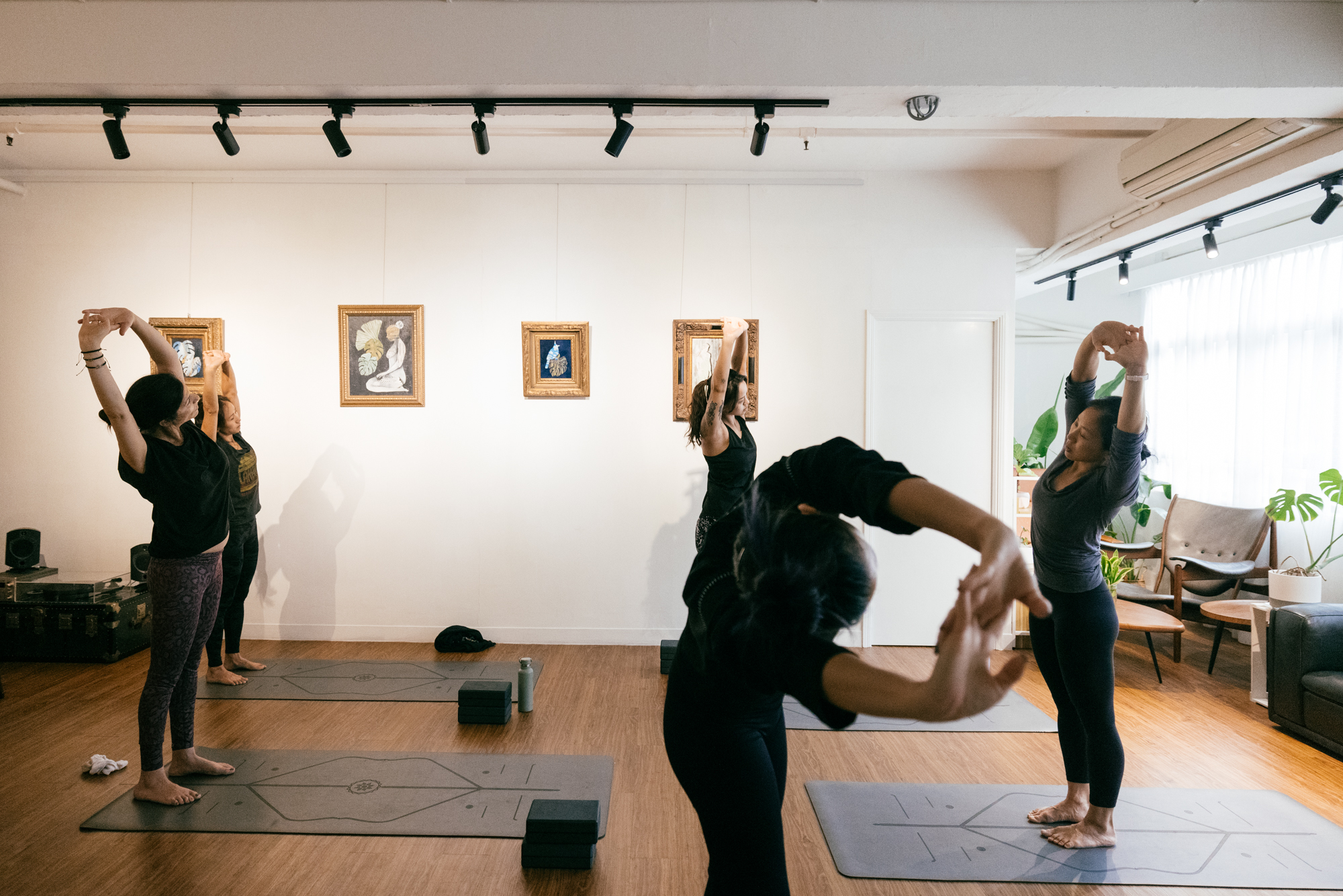 Vinyasa yoga class in Kennedy Town | Class stretching arms | workshop ten